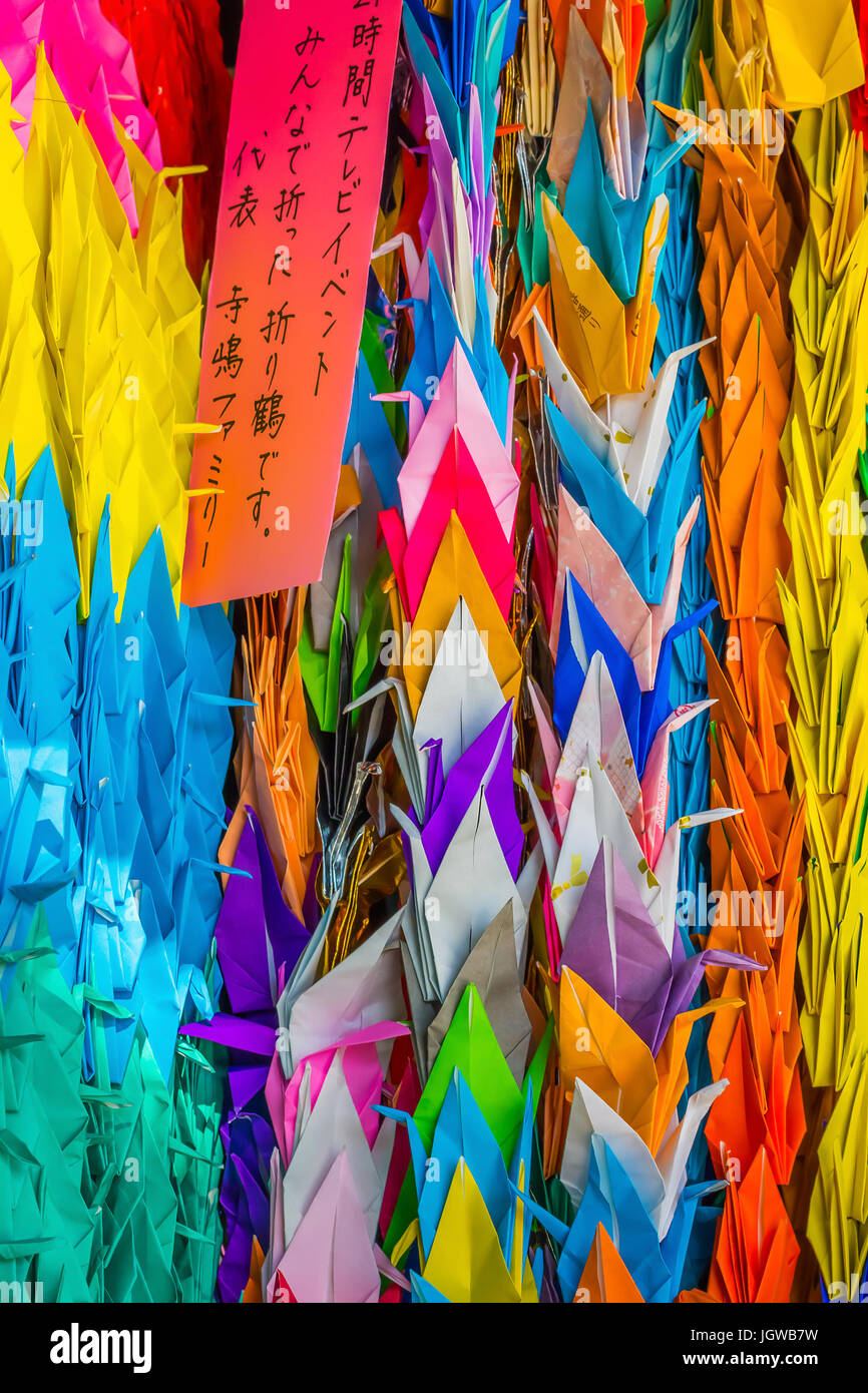 Colorful paper folded cranes at Hiroshima Central Park Stock Photo