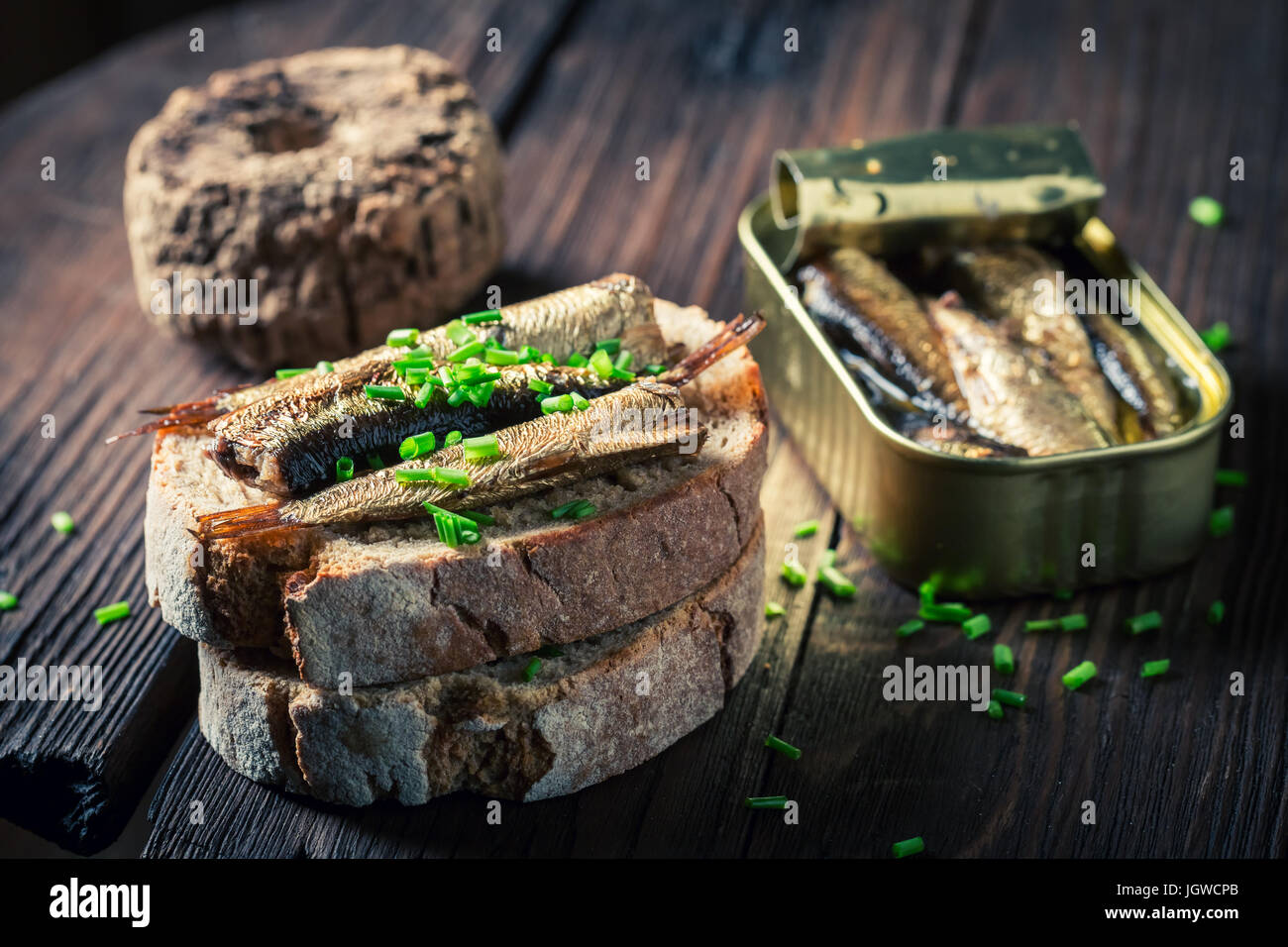 Healthy sandwich with sardines, chive and wholegrain bread Stock Photo