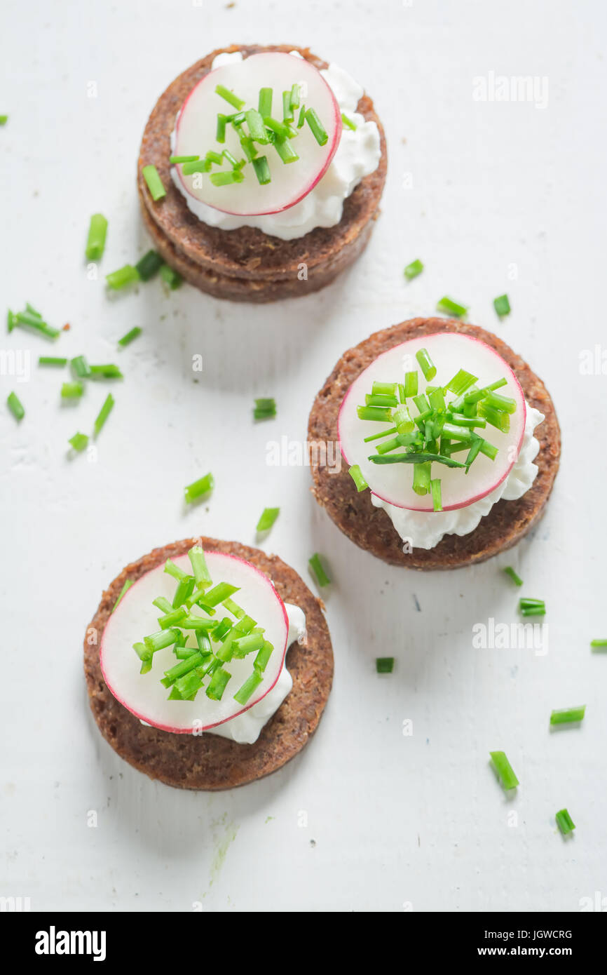 Sandwich with pumpernickel bread, cottage cheese and chive Stock Photo