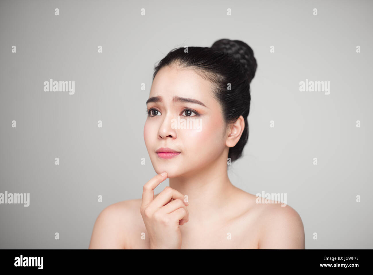 Happy smiling beautiful asian woman touching her face Stock Photo - Alamy