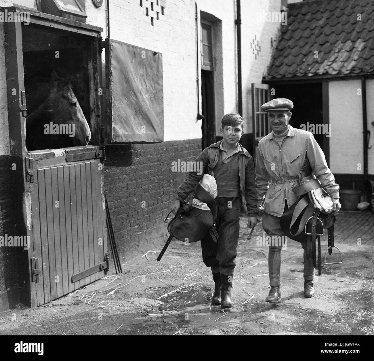 Jockey and stable lad at racing stables Britain 1950s Stock Photo