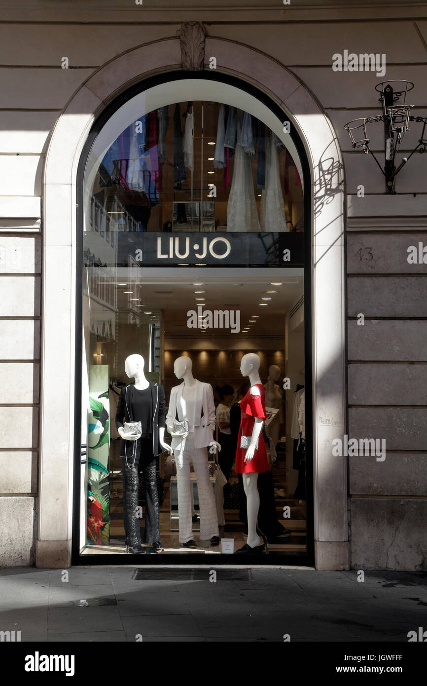 Liu Jo store. Pedestrians look the shop window in downtown Rome Italy Stock Photo