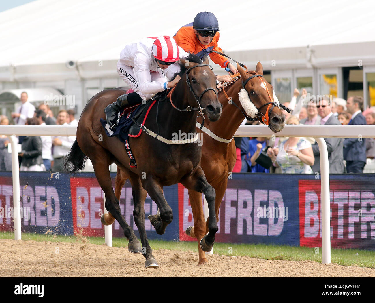 Cape Peninsular ridden by Jockey Martin Harley (left) and Suitor ridden by Jockey Ben Robinson (right) during the Betfred 'Home Of Goals Galore' Handicap Stock Photo