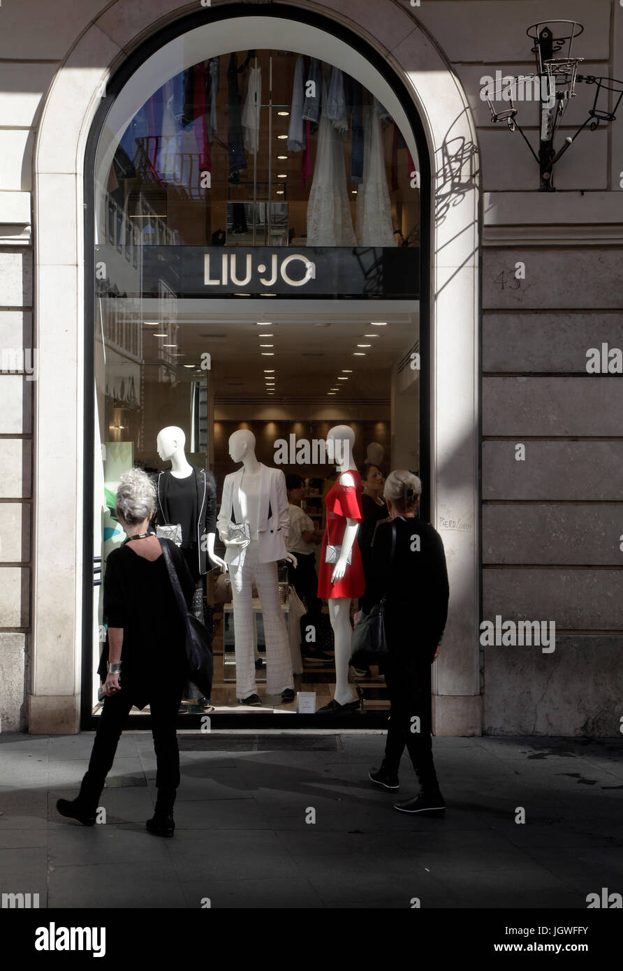 Liu Jo store. Pedestrians look the shop window in downtown Rome Italy Stock Photo