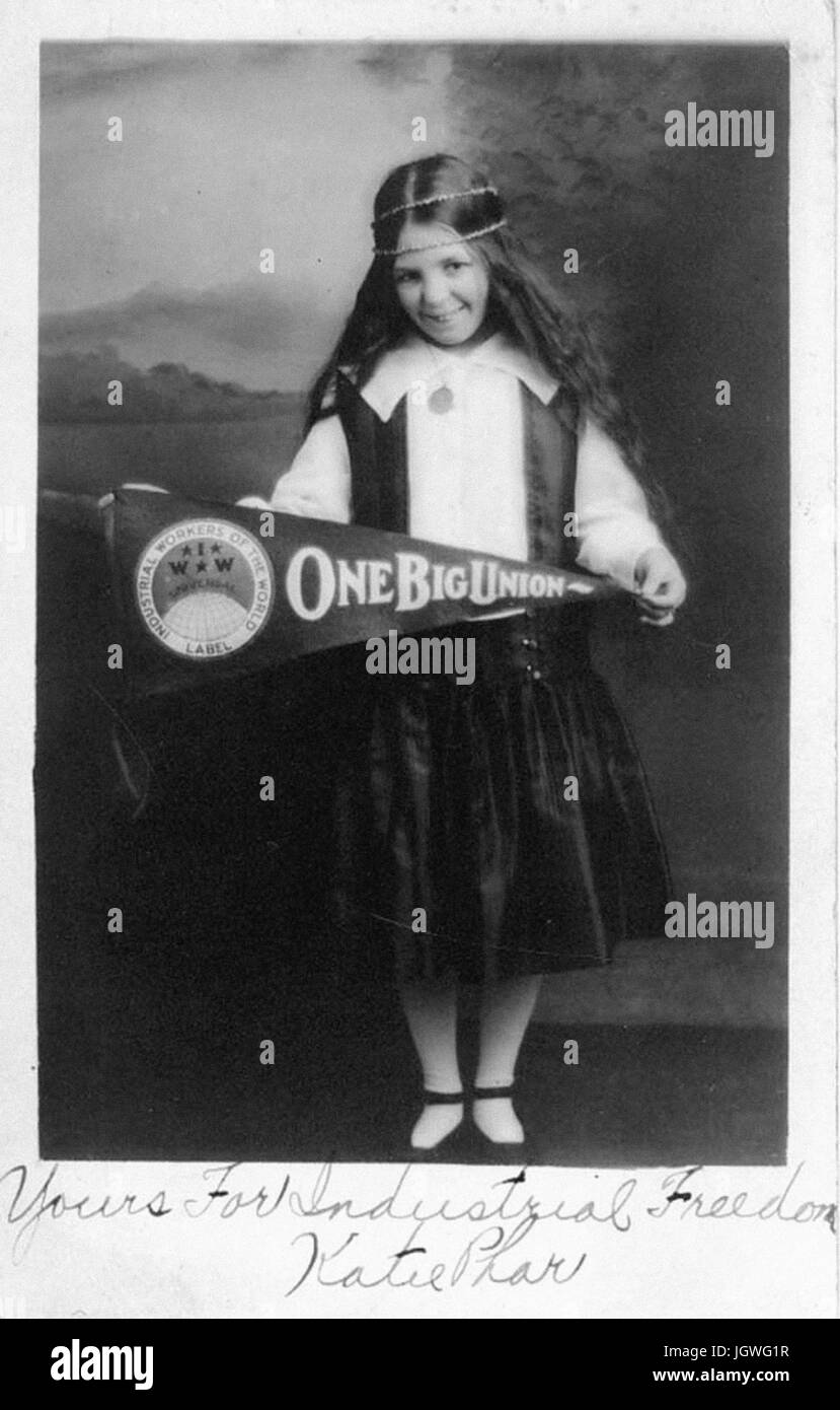 Industrial Workers of the World Katie Phar holding One Big Union flag
