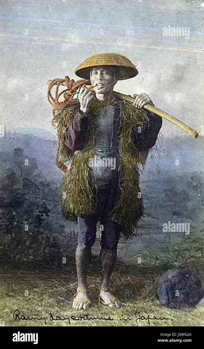 Man in traditional straw raincoat Japan Stock Photo Alamy