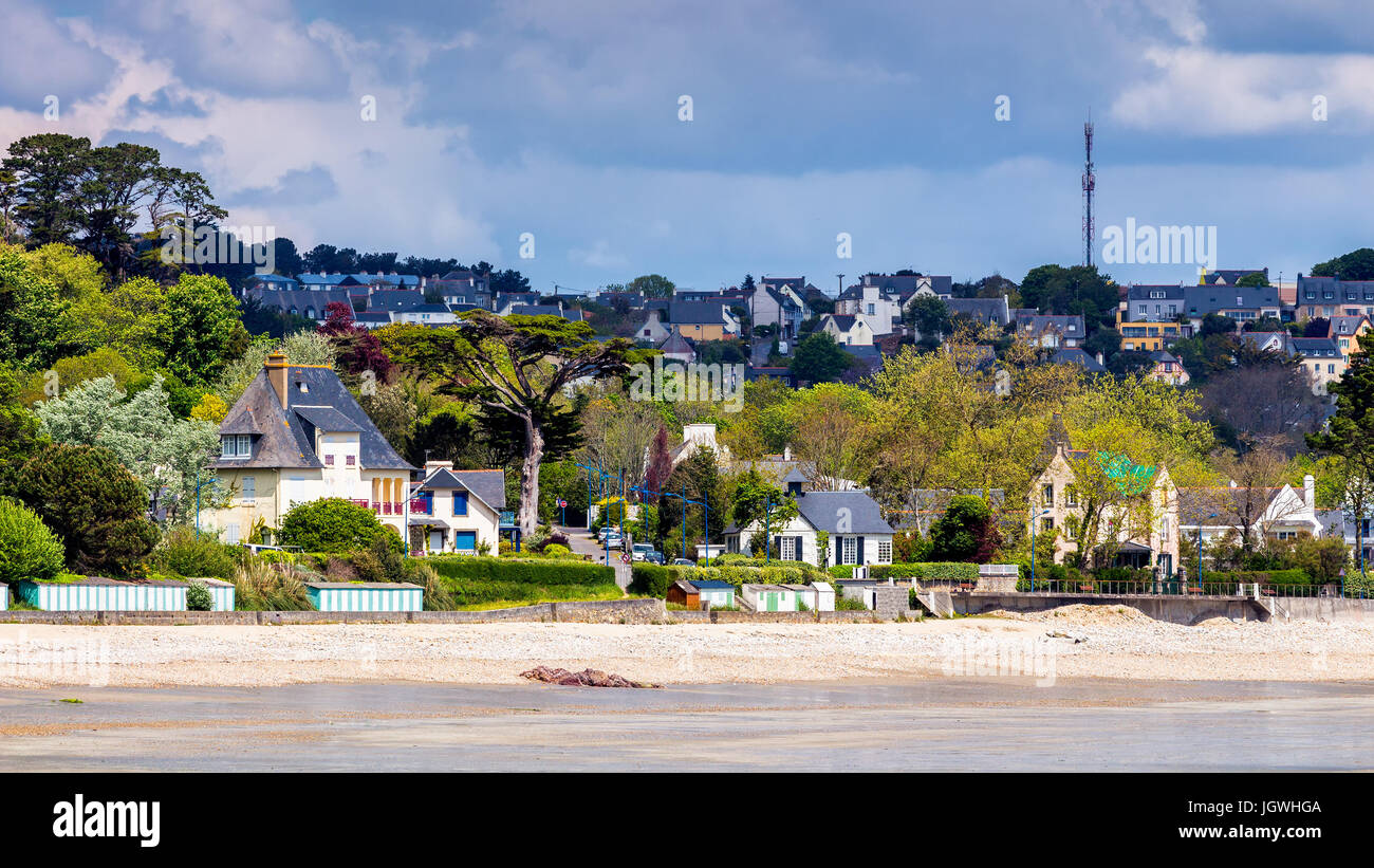 Beautiful village of with the sand beach and rocky coastline