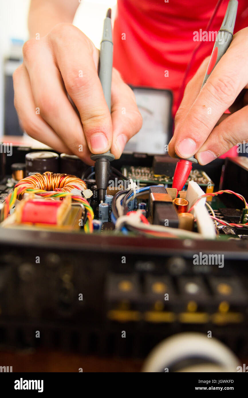 REPAIRING ELECTRONICS WITH TEST EQUIPMENT Stock Photo Alamy