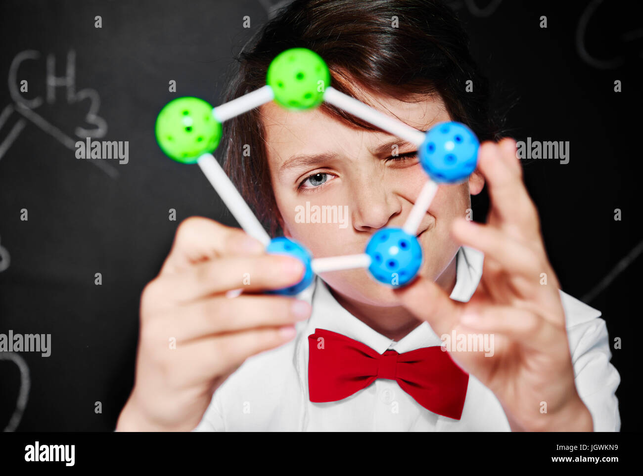 Small scientist analyzing molecule Stock Photo