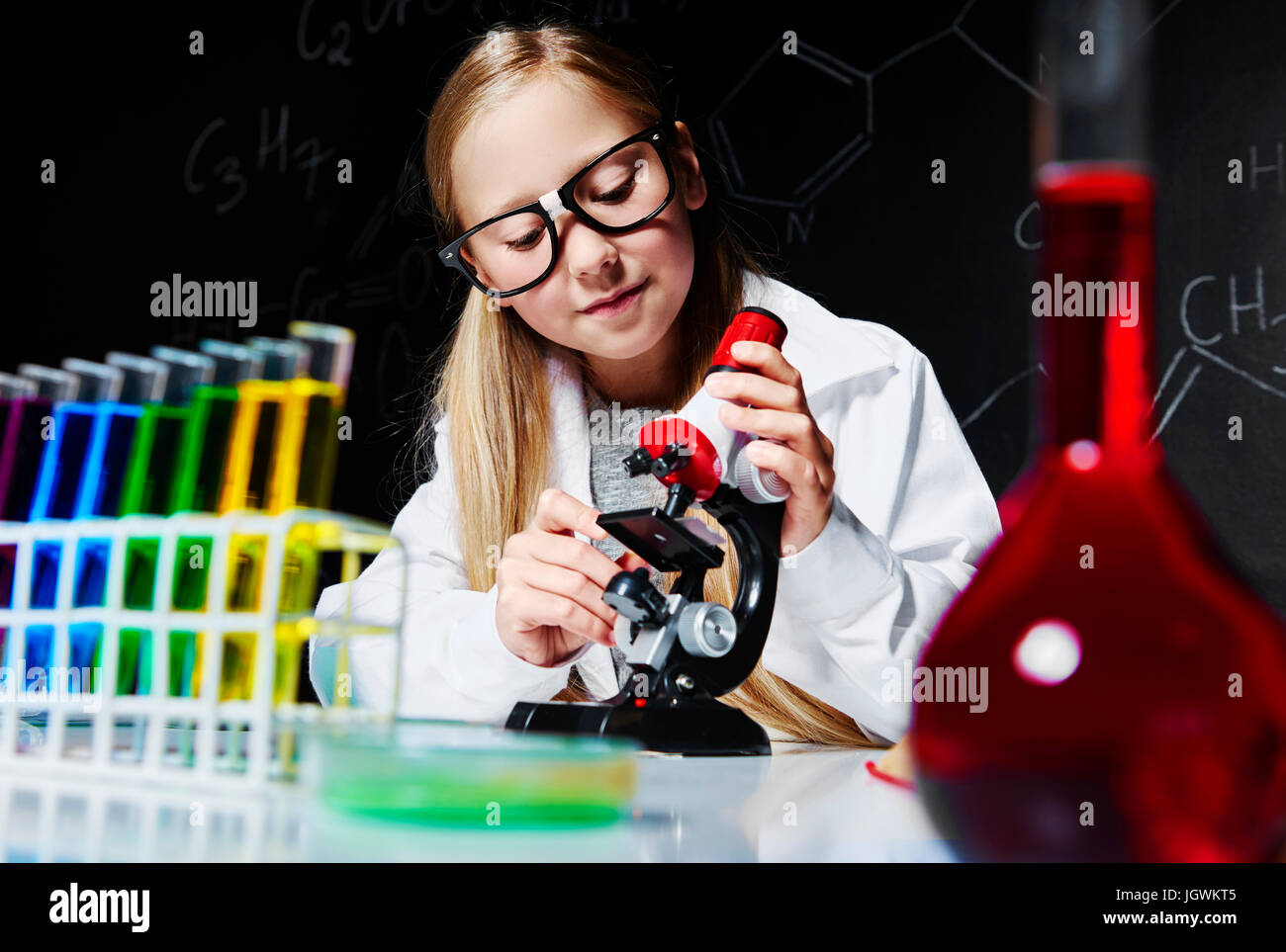 Small girl working in laboratory Stock Photo
