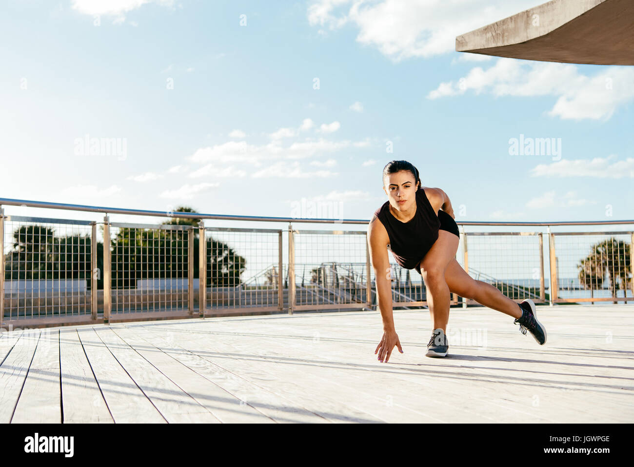 Young woman exercising outdoors, South Point Park, Miami Beach, Florida, USA Stock Photo
