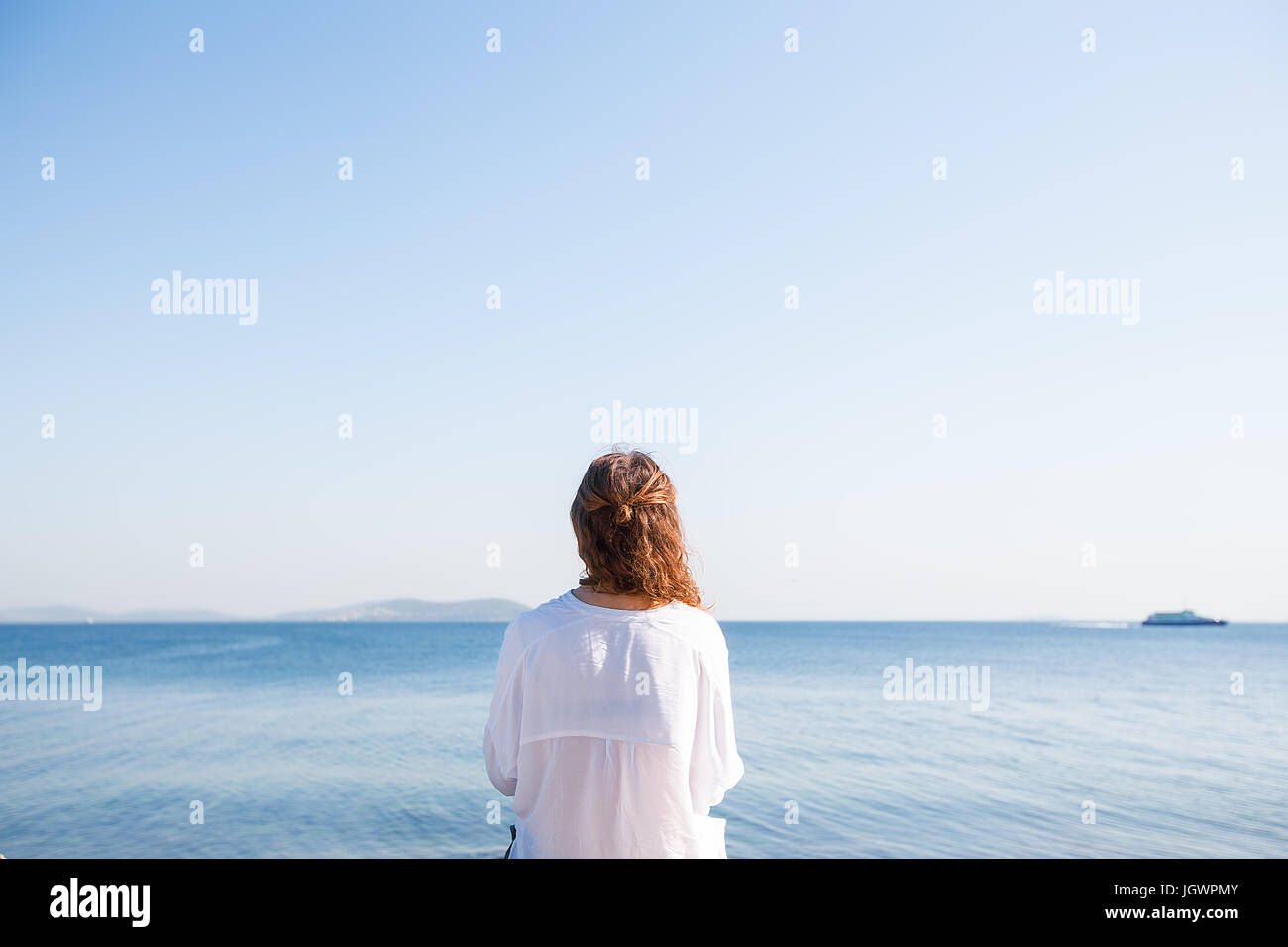 Woman on holiday by the seaside, Istanbul, Turkey, Asia Stock Photo