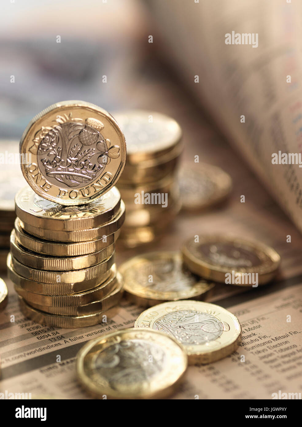 Still life of British currency on financial newspaper, close-up Stock Photo