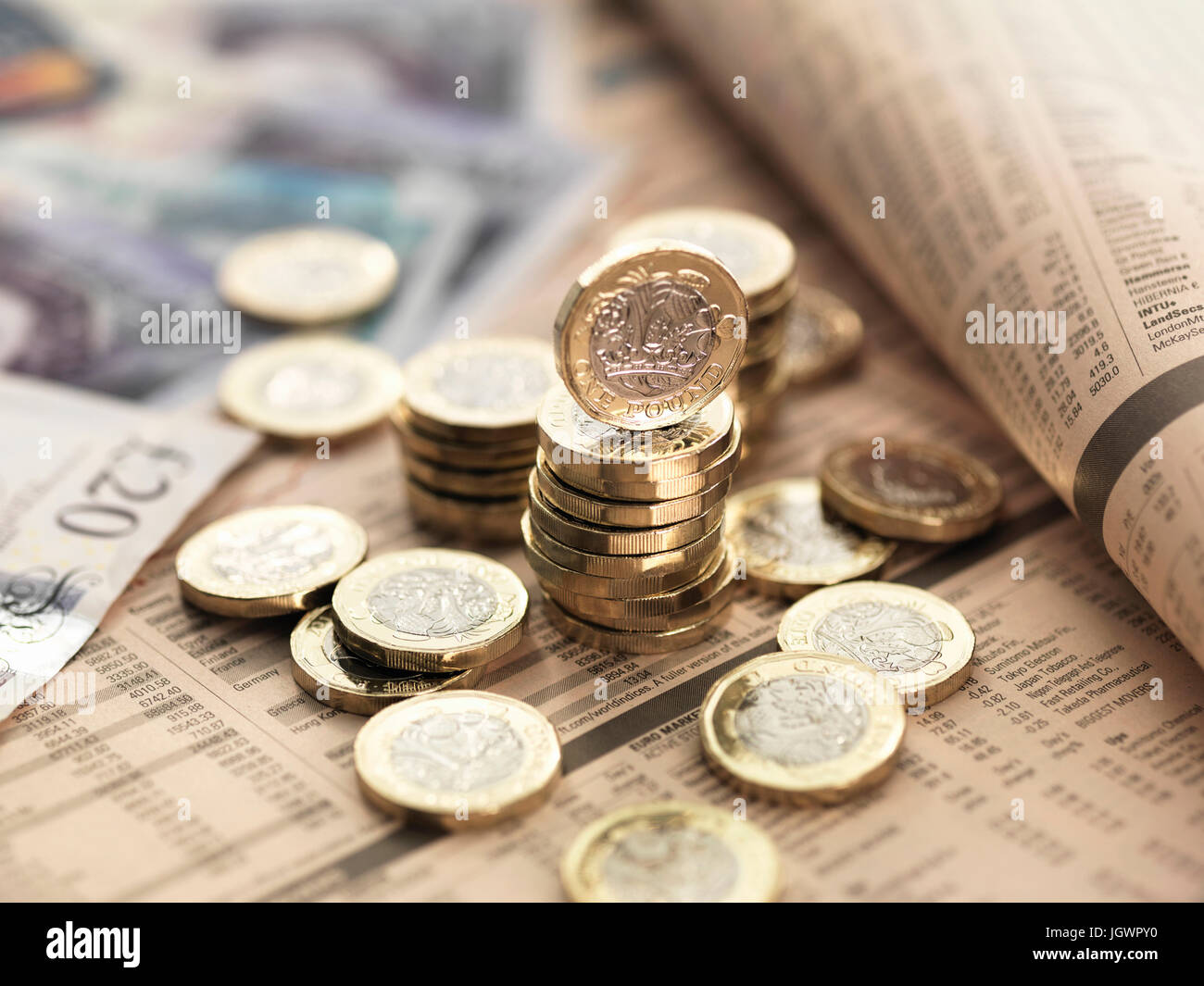 Still life of British currency on financial newspaper, close-up Stock Photo