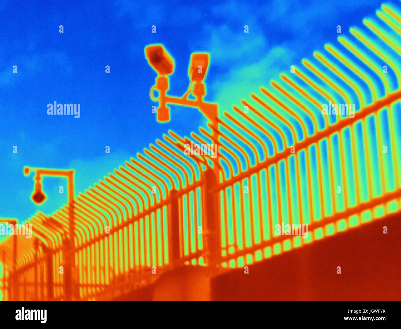 Thermal photograph of security cameras and fence Stock Photo Alamy