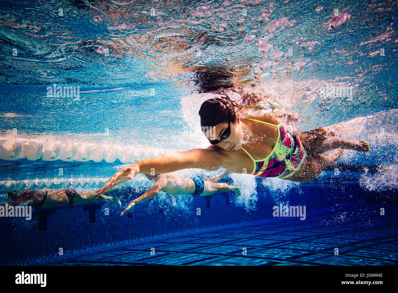 Swimmers doing freestyle in lane Stock Photo
