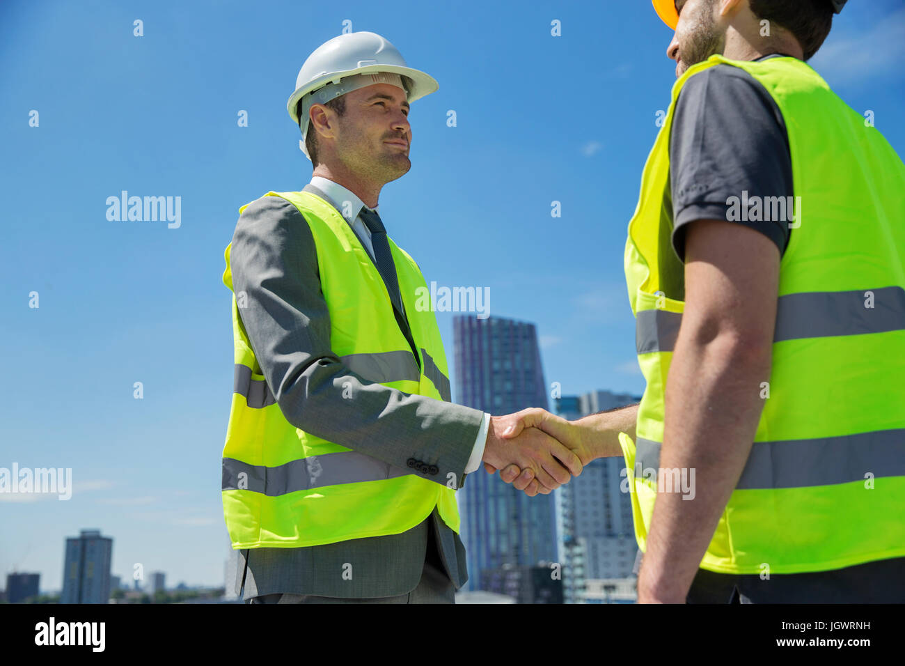 Two men wearing hard hats and safety vests Image & Design ID 0000393107 