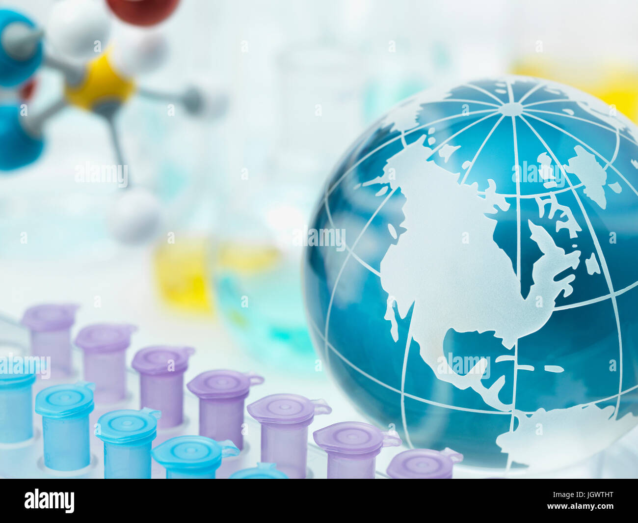 Globe showing the Americas with test tube holder Stock Photo