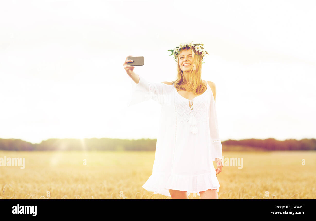 happy young woman taking selfie by smartphone Stock Photo - Alamy