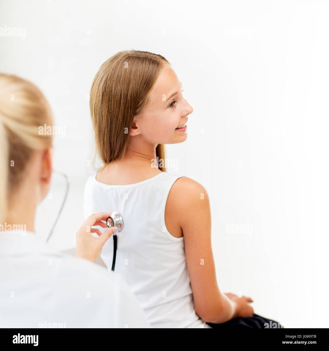 doctor with stethoscope and girl at hospital Stock Photo Alamy