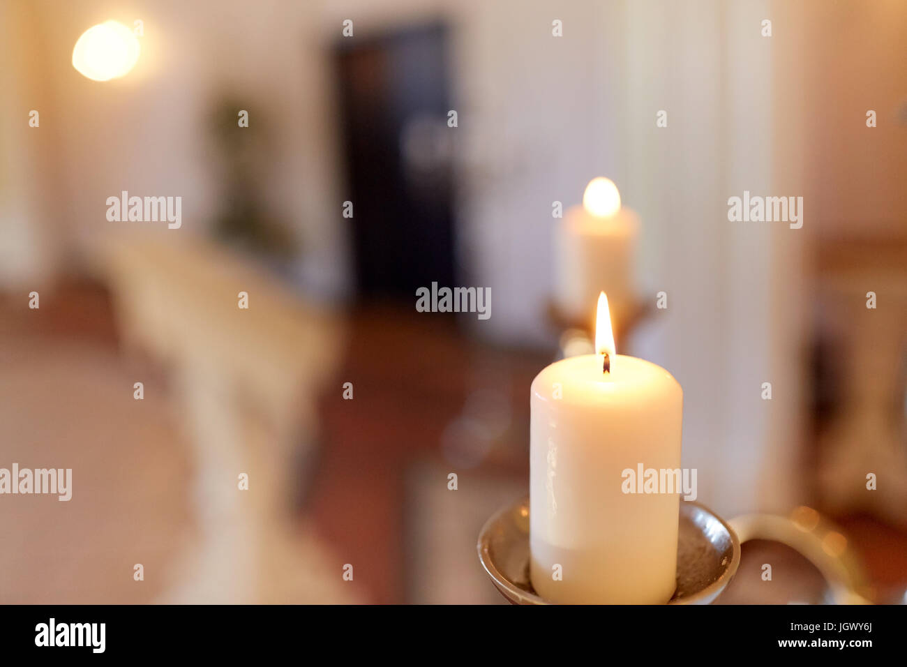 candles burning in church Stock Photo Alamy