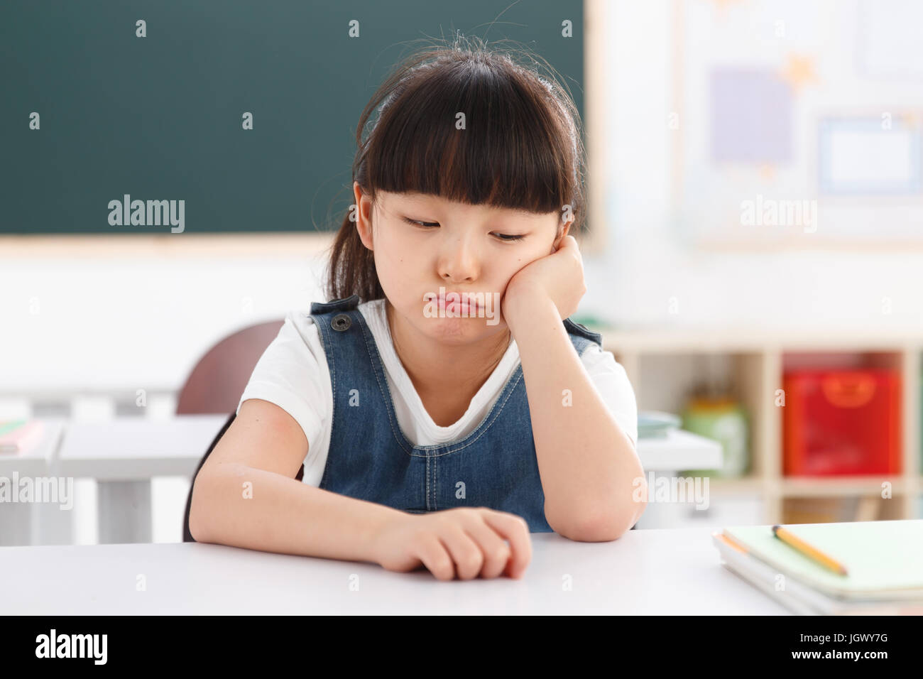 Portrait of a girl sitting in classroom Stock Photo - Alamy