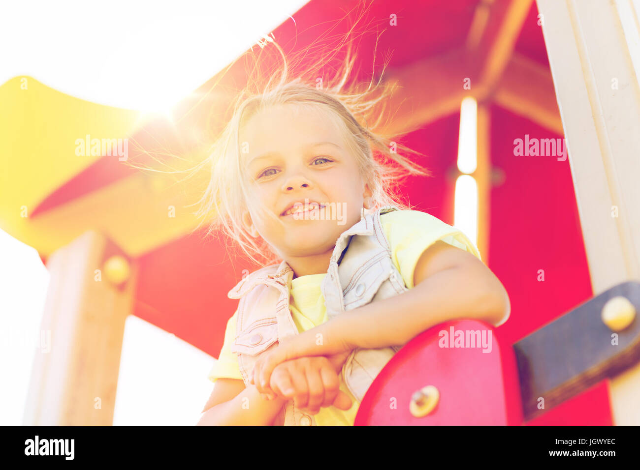 happy little girl on children playground Stock Photo - Alamy