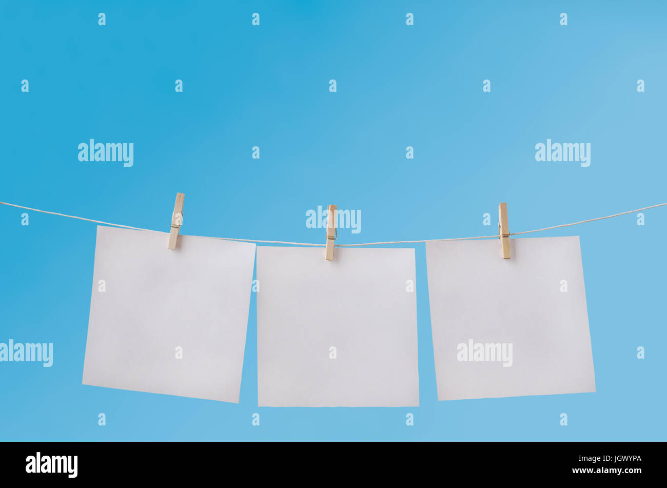 Clothes line blue background hi-res stock photography and images