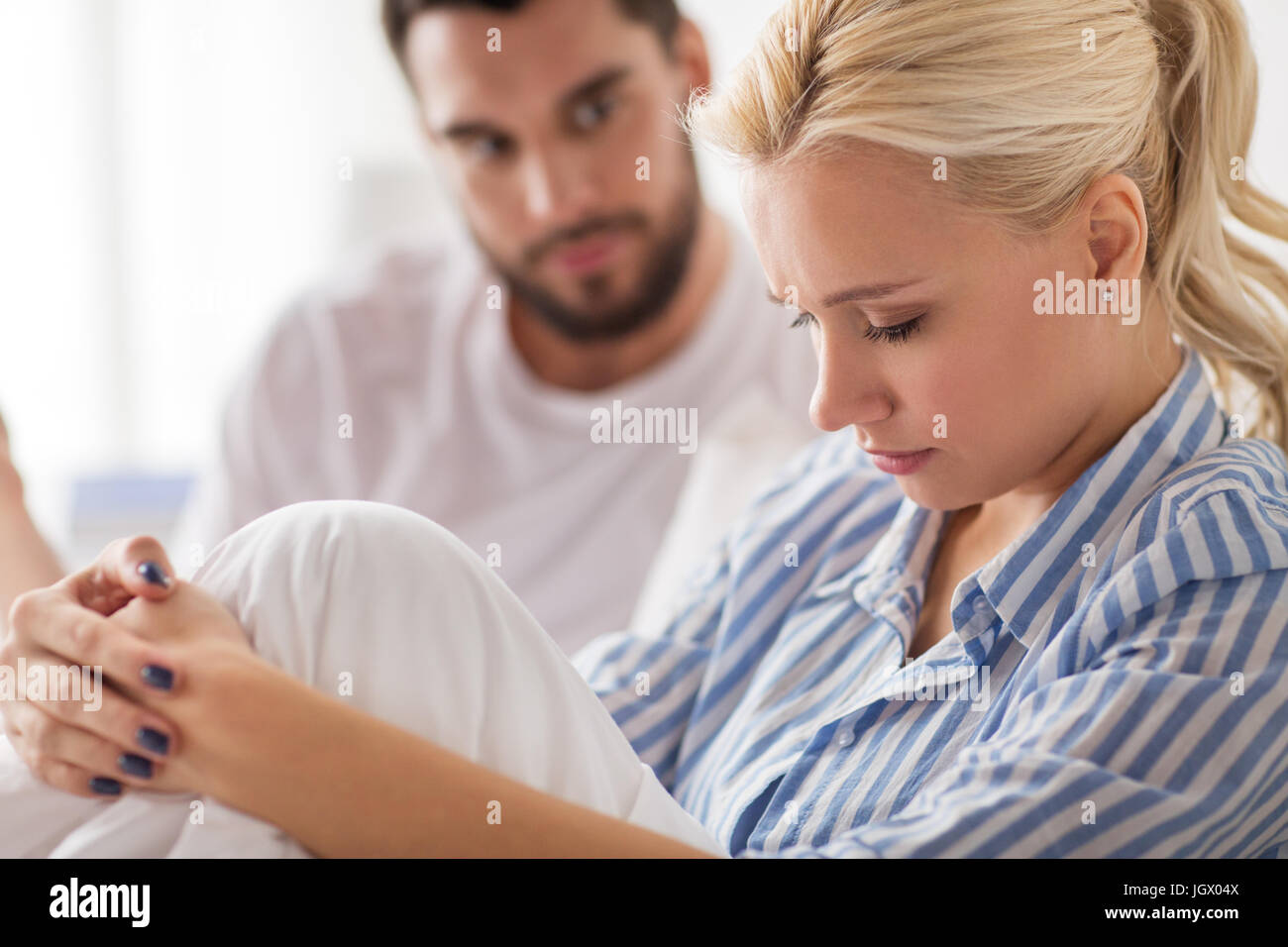 unhappy couple having conflict in bed at home Stock Photo - Alamy
