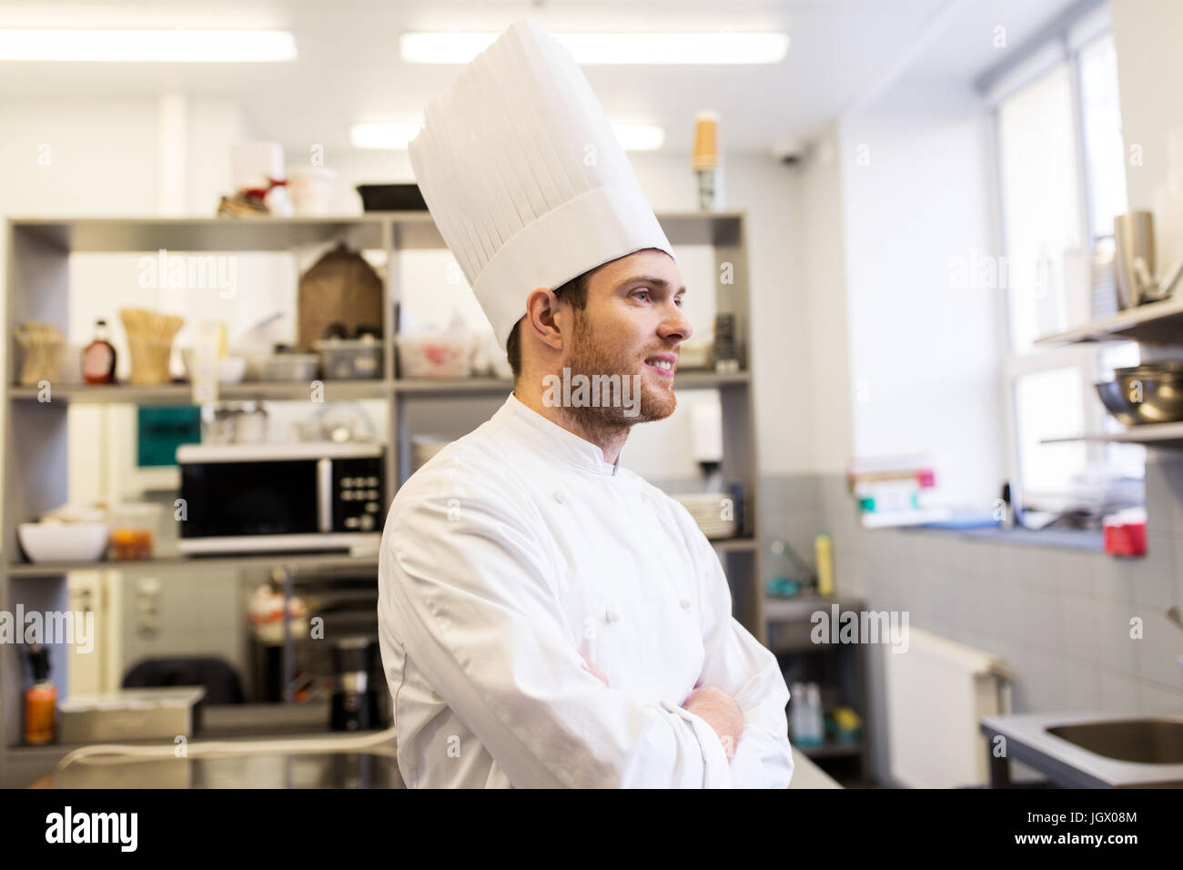 happy male chef cook at restaurant kitchen Stock Photo