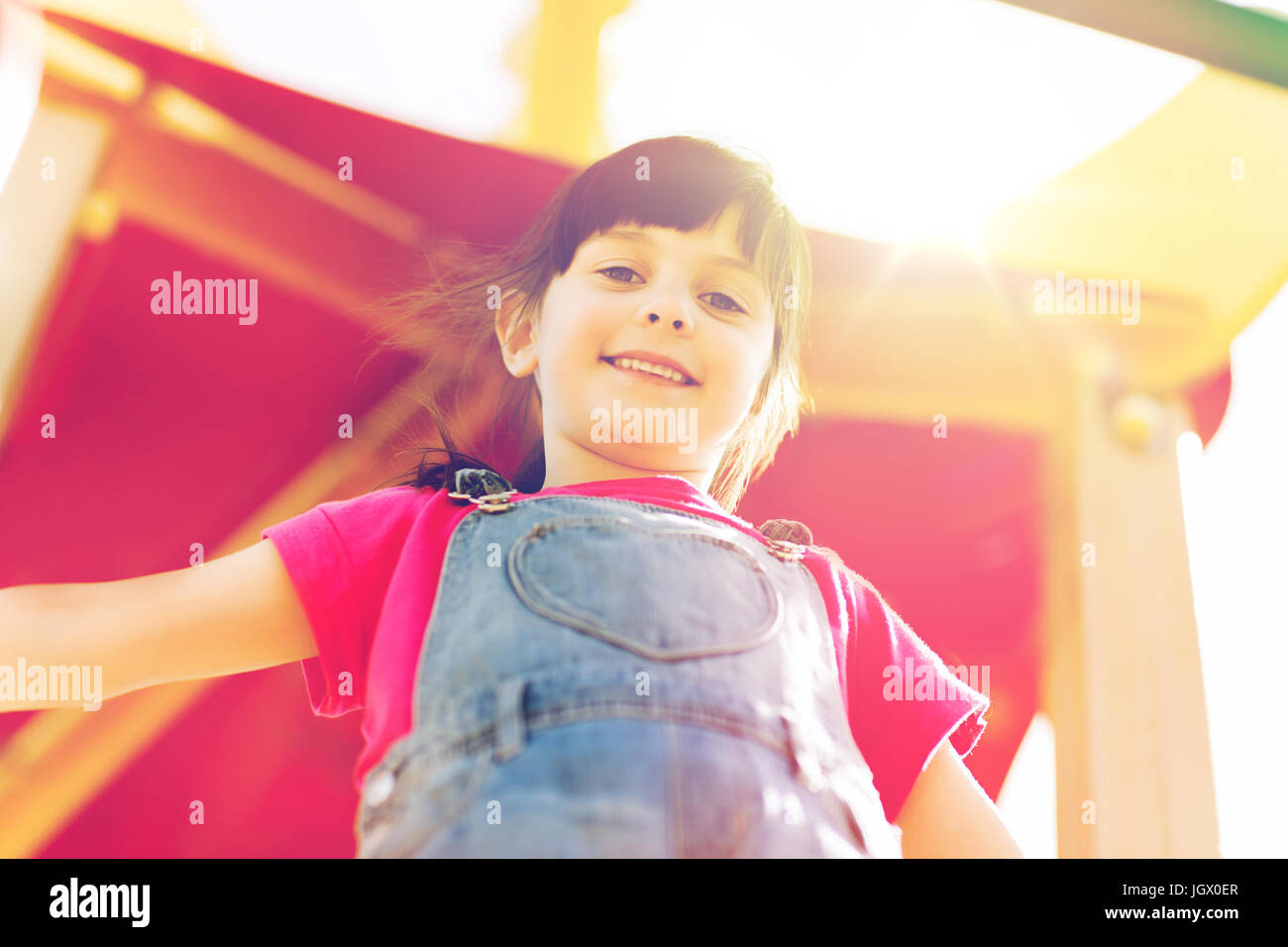 happy little girl on children playground Stock Photo - Alamy