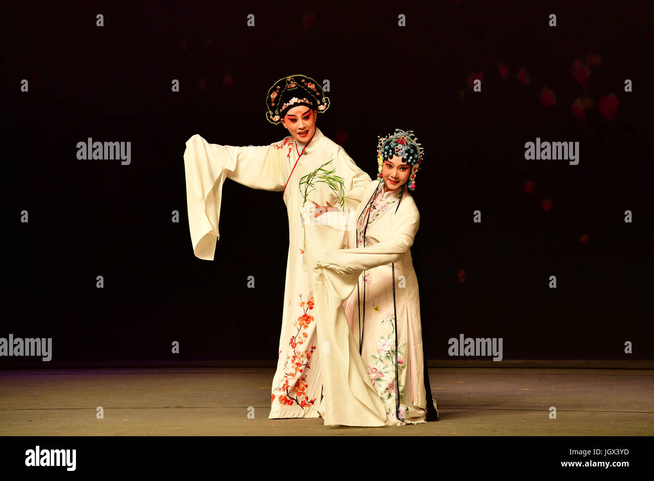 (170711) -- ZHENGZHOU, July 11, 2017 (Xinhua) -- Troupers of the Northern Kunqu Opera Theatre perform Kunqu Opera 'the Peony Pavilion' in Zhengzhou, capital of central China's Henan Province, July 9, 2017. 'Peony Pavilion', created by ancient Chinese playwrite Tang Xianzu (1550-1616), tells a love story between Du Liniang and Liu Mengmei, embodying young people's pursuit of love and freedom.  (Xinhua/Feng Dapeng) (ry) Stock Photo