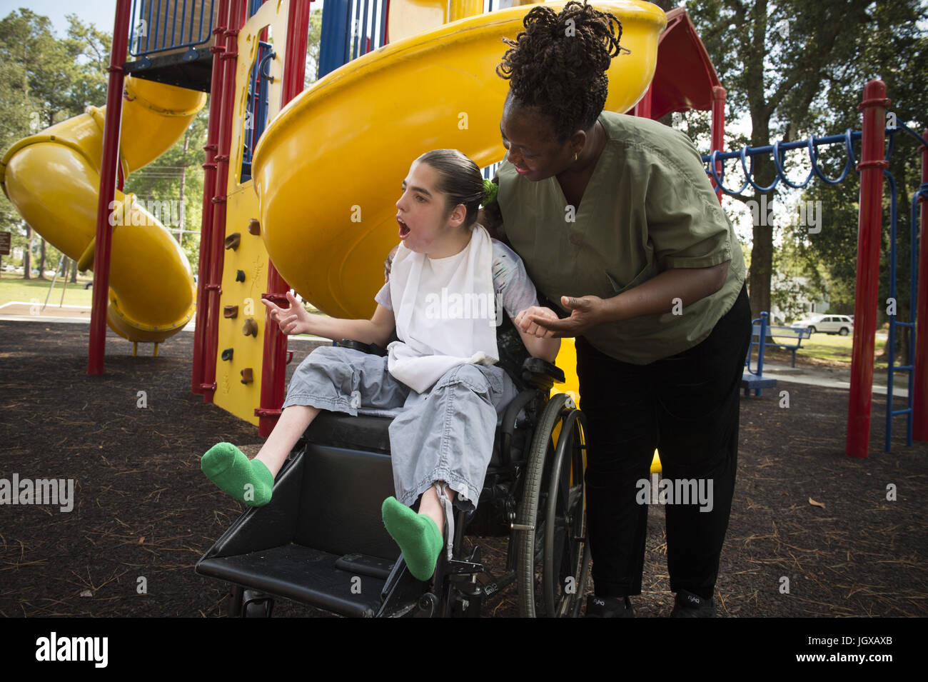Valdosta, GA, USA. 3rd Sep, 2014. Cynthia Parker and her caregiver play