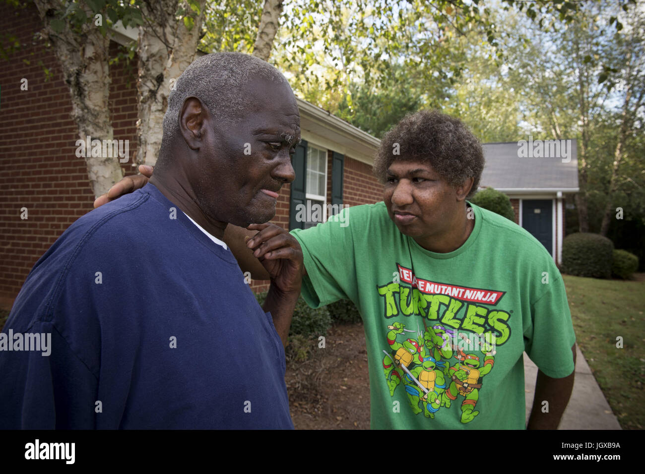 Athens, GA, USA. 13th Oct, 2014. Howard Jackson and Perry Hendricks at their duplex apartment.They are supported by staff from the Georgia Options non-profit organization that helps individuals with developmental disabilities live independently, with funding from their Medicaid waivers. Both men lived in state institutions for decades before transitioning to their own home. Credit: Robin Rayne Nelson/ZUMA Wire/Alamy Live News Stock Photo