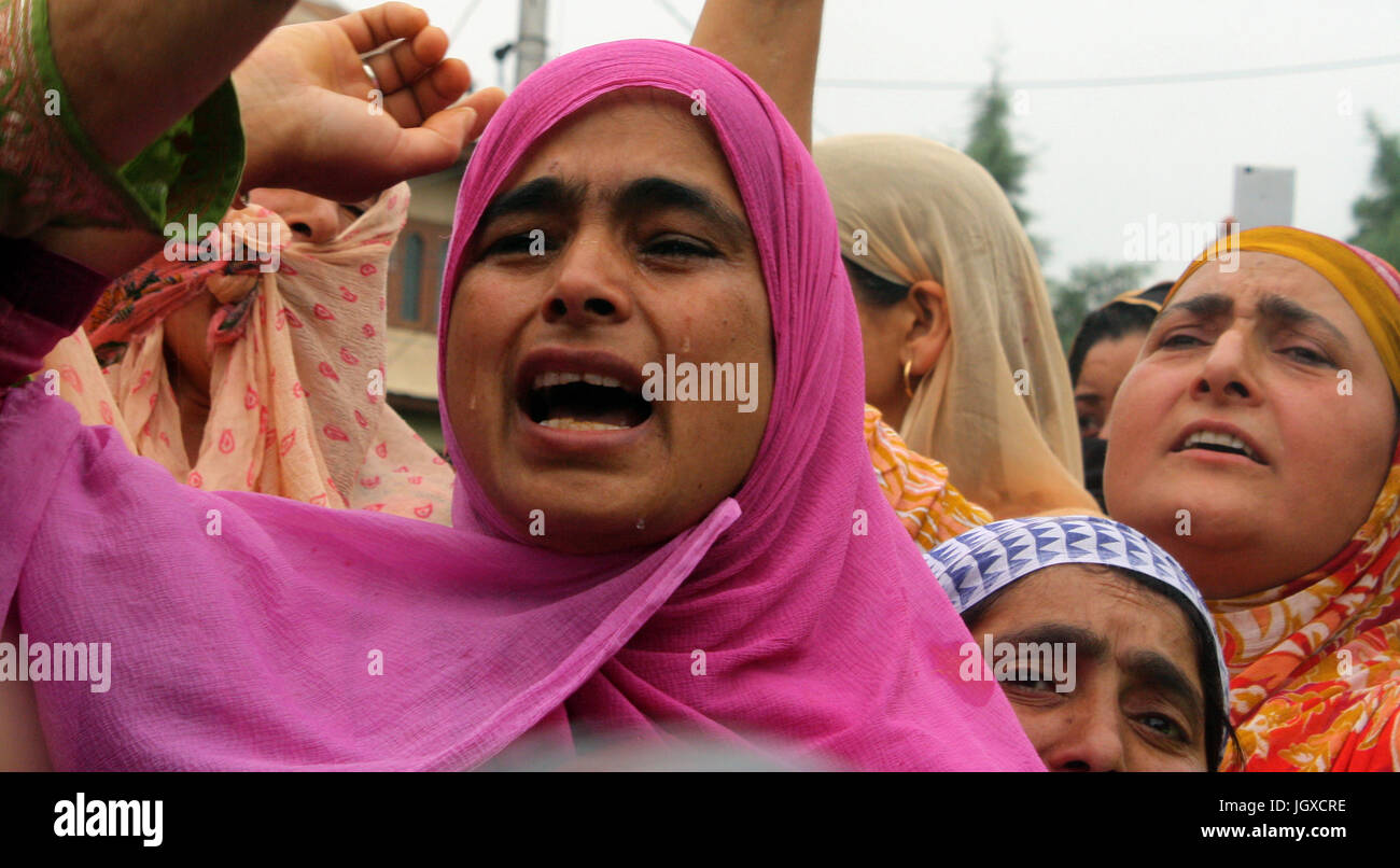 Srinagar, Kashmir. 12th Jul, 2017.  un Identified relative wails during funeral prayer. Javed Sheikh, Dawood and Aquib. Sheikh were the Hizbul district commanders after three militants belonging to Hizbul Mujahideen (HM) outfit were killed on Tuesday evening in Jammu and Kashmir. Badgam district in a gunfight with the security forces, police said.  Credit: Sofi Suhail/Alamy Live News Stock Photo