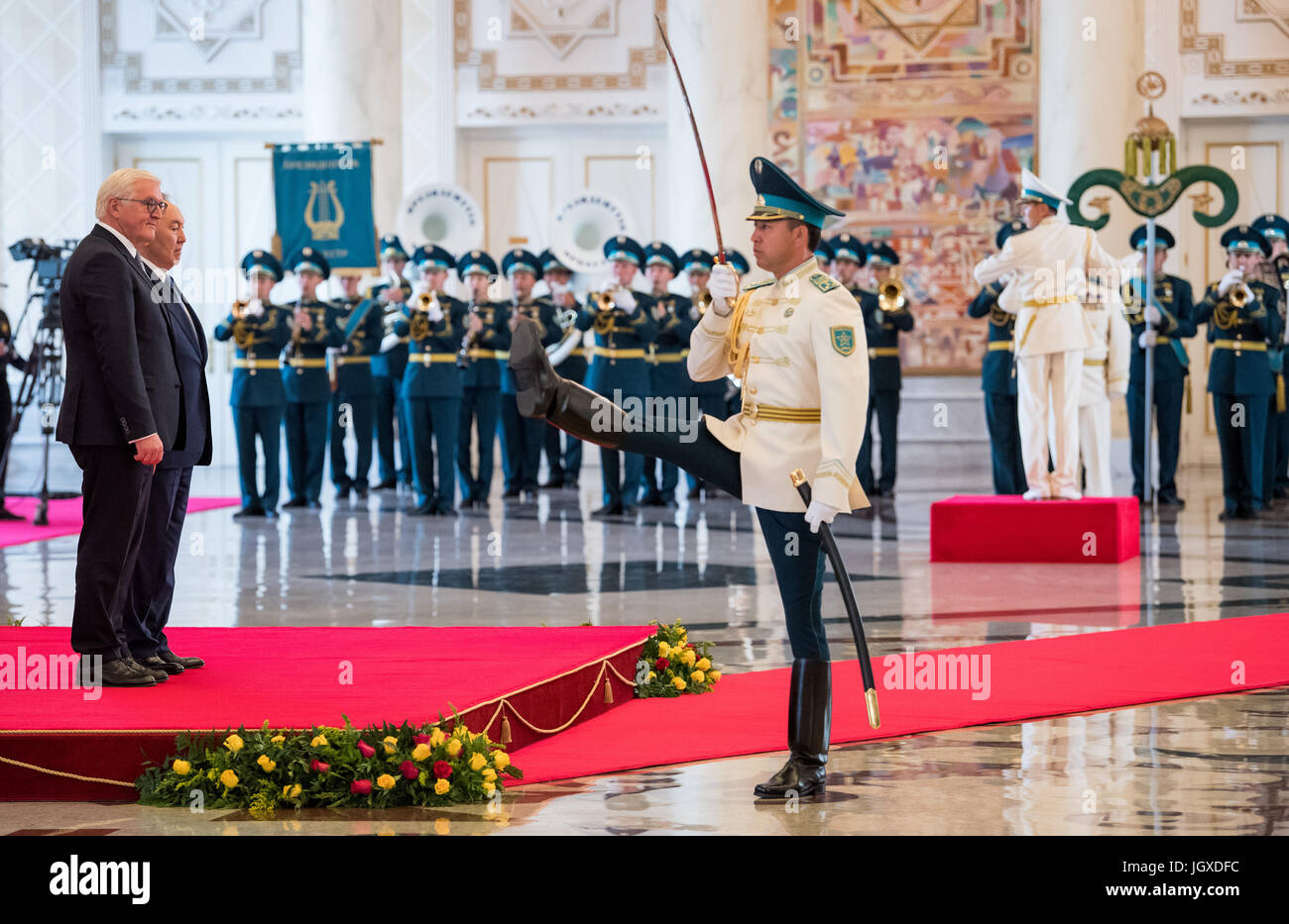 Astana, Kazakhstan. 12th July, 2017. dpatop - German President Frank-Walter Steinmeier (L) is welcomed by Kazakhstan's President Nursultan Nazarbayev with military honours at the Presidential Palace in Astana, Kazakhstan, 12 July 2017. The main purpose of Steinmeier and his wife's three-day-visit to Kazakhstan is the World's fair Expo 2017 in the capital Astana. Photo: Bernd von Jutrczenka/dpa/Alamy Live News Stock Photo