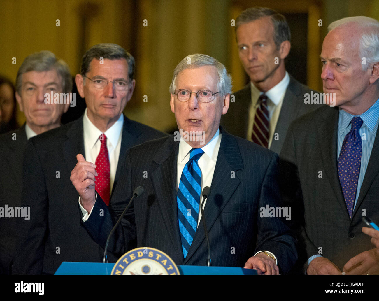 United States Senate Majority Leader Mitch McConnell (Republican of Kentucky), center, speaks to reporters following the Republican Party luncheon in the United States Capitol in Washington, DC on Tuesday, July 11, 2017. From left to right: US Senator Roy Blunt (Republican of Missouri), US Senator John Barrasso (Republican of Wyoming), Leader McConnell, US Senator John Thune (Republican of South Dakota) and US Senator John Cornyn (Republican of Texas). In his remarks, McConnell announced he will keep the Senate in session for the first two weeks of August, delaying their summer recess. Credit: Stock Photo