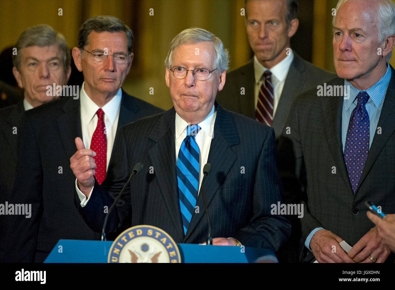 United States Senate Majority Leader Mitch McConnell (Republican of Kentucky), center, speaks to reporters following the Republican Party luncheon in the United States Capitol in Washington, DC on Tuesday, July 11, 2017. From left to right: US Senator Roy Blunt (Republican of Missouri), US Senator John Barrasso (Republican of Wyoming), Leader McConnell, US Senator John Thune (Republican of South Dakota) and US Senator John Cornyn (Republican of Texas). In his remarks, McConnell announced he will keep the Senate in session for the first two weeks of August, delaying their summer recess. Credit: Stock Photo