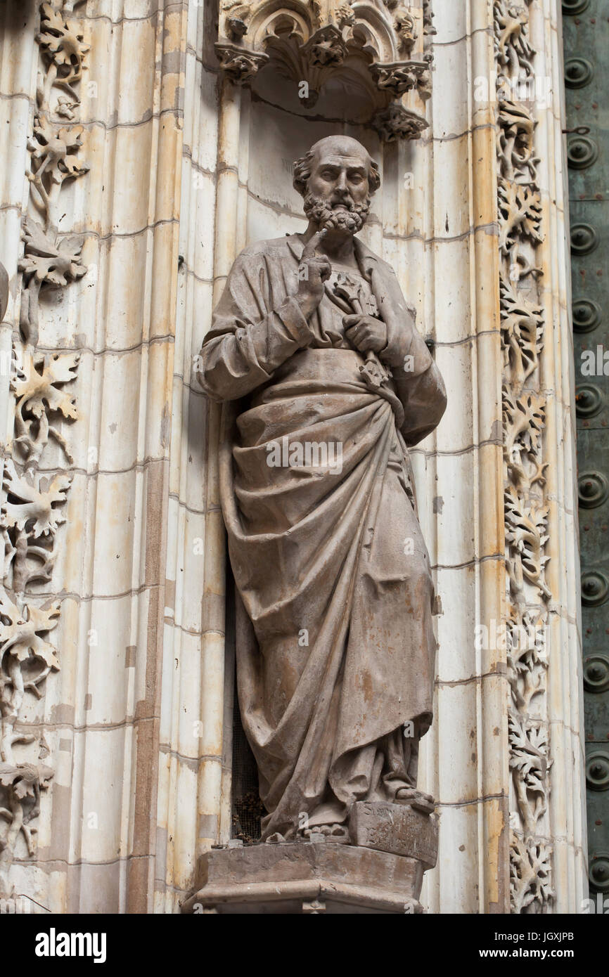 Saint Peter the Apostle. Statue on the Portal of the Assumption (Puerta de la Asunción) of the Seville Cathedral (Catedral de Sevilla) in Seville, Andalusia, Spain. Stock Photo