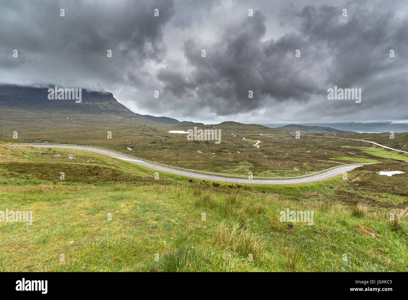 Picturesque view of the A894 between Unapool and Skaig Bridge. The road is part of the North Coast 500 route. Stock Photo