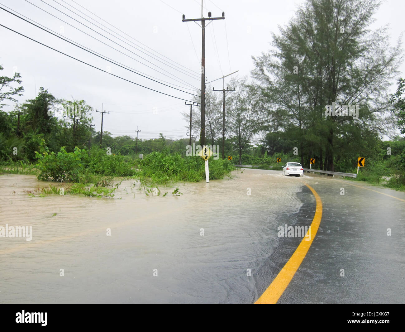 Flooded road during the monsoon season in Phang Nga, Thailand Stock Photo