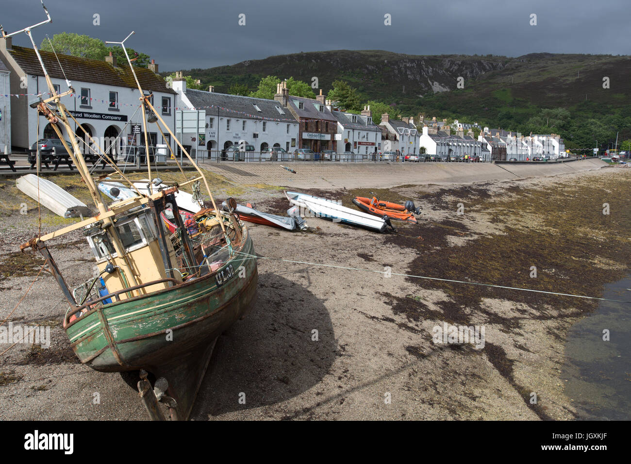 Town of Ullapool, Scotland. Picturesque view of Ullapool’s waterfront at low tide, with Shore Street in the background. Stock Photo