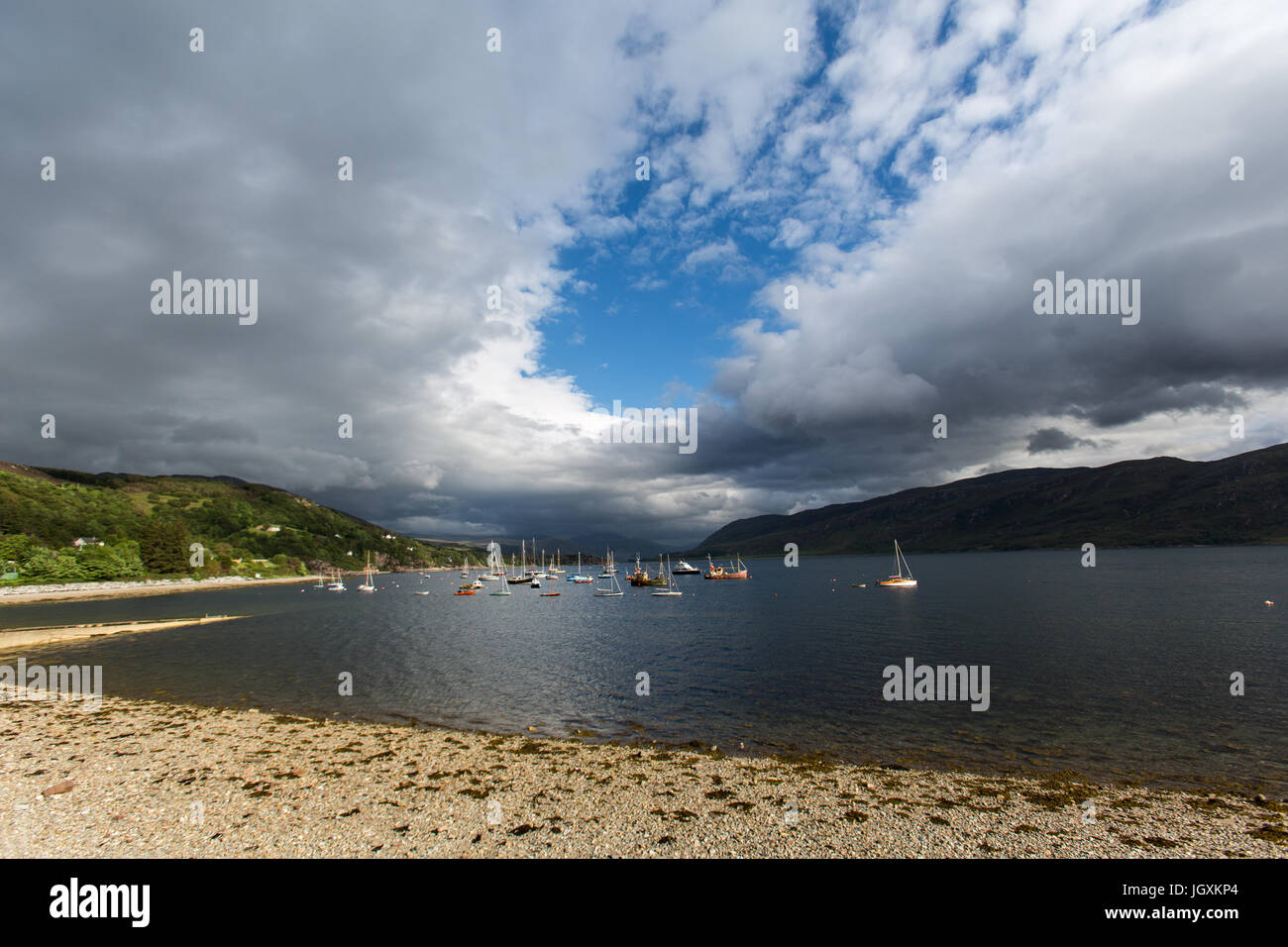 Town of Ullapool, Scotland. Picturesque view of sail and power boats moored in Loch Broom. Stock Photo