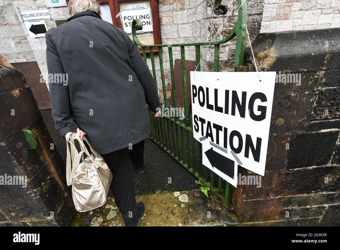 A person arrives to cast their vote at various polling stations around the city of Plymouth for the Geneneral Election 2017. Stock Photo