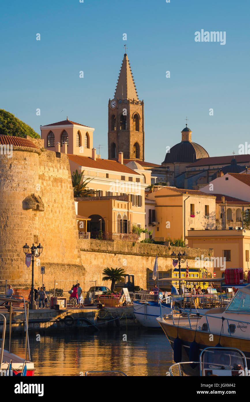 Alghero port Sardinia, view of the medieval wall and tower - the Bastione la Maddalena - in the harbour area of Alghero, Sardinia, Italy. Stock Photo