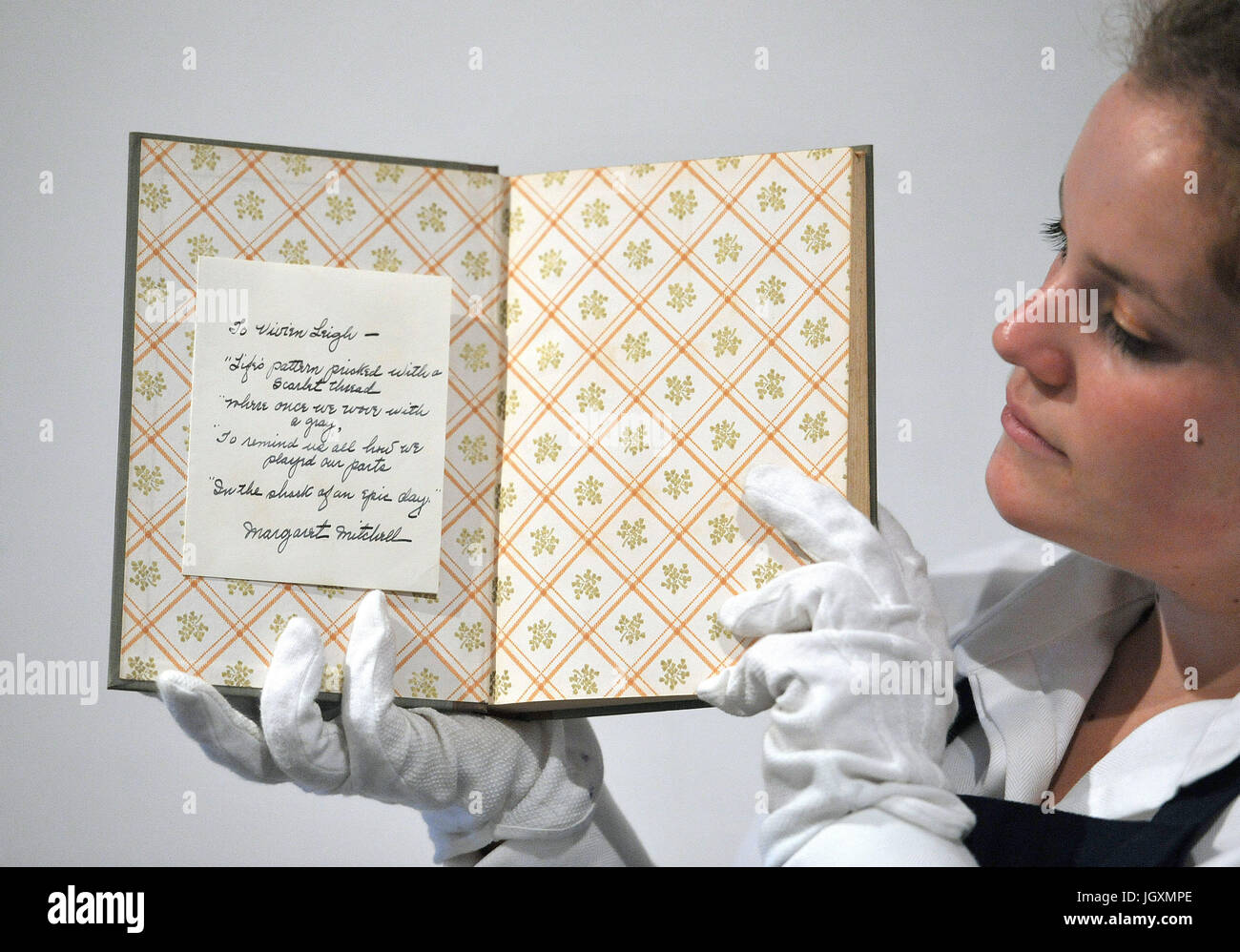 Vivien Leigh's personal copy of 'Gone With The Wind' inscribed by its author Margaret Mitchell with a hand written poem, on display at Sotheby's in London as the family of the Gone With The Wind star are selling 250 treasures once belonging to the actress from Hollywood's Golden Age. Stock Photo