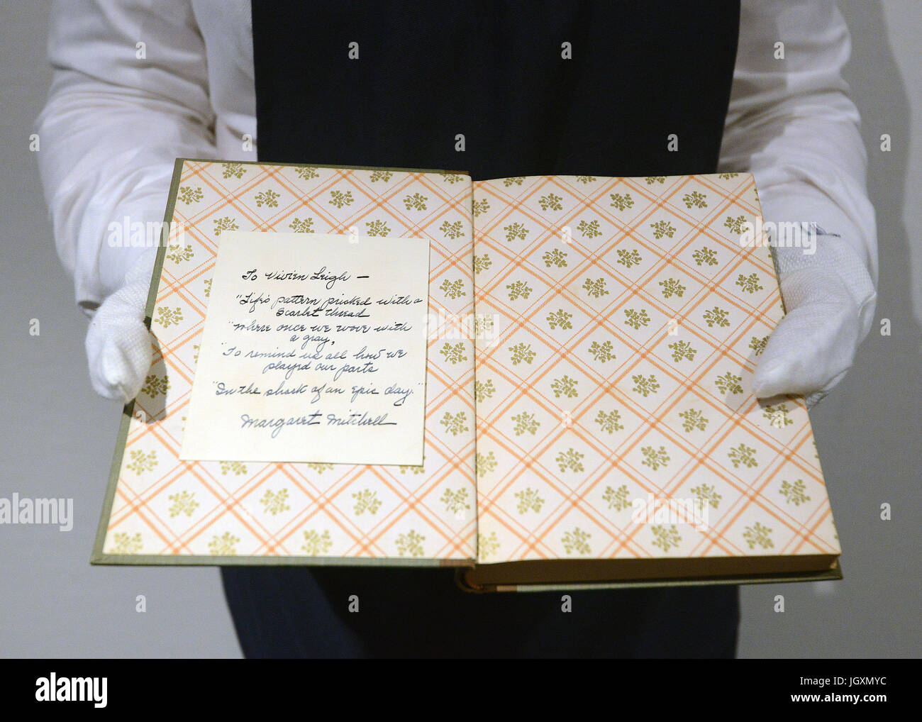 Vivien Leigh's personal copy of 'Gone With The Wind' inscribed by its author Margaret Mitchell with a hand written poem, on display at Sotheby's in London as the family of the Gone With The Wind star are selling 250 treasures once belonging to the actress from Hollywood's Golden Age. Stock Photo