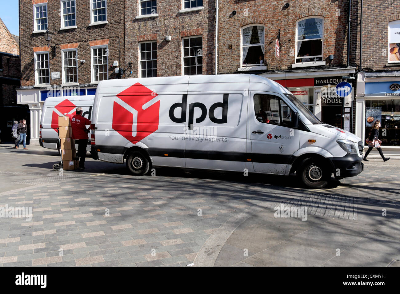 DPD courier delivery van delivering goods in the center centre of York, UK. Stock Photo