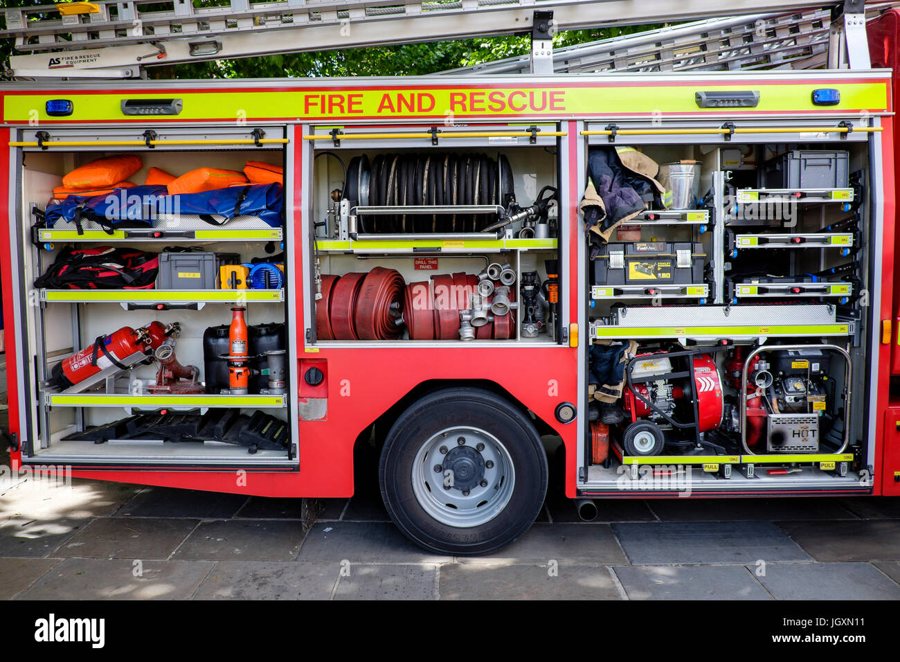 Firefighting fire-fighting and rescue equipment in a British fire engine truck tender. Stock Photo