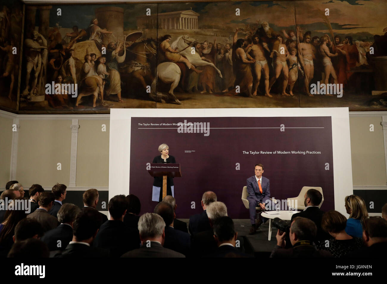 Prime Minister Theresa May delivers a speech alongside Royal Society of Arts chief executive Matthew Taylor at the launch of The Taylor Review of Modern Working Practices, at the RSA in London. Stock Photo